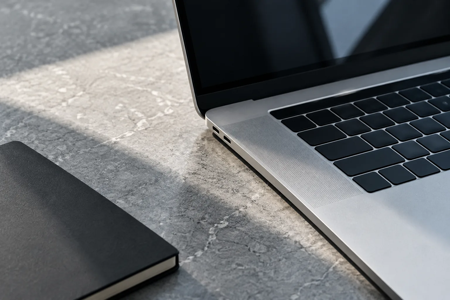 MacBook on a stone desk